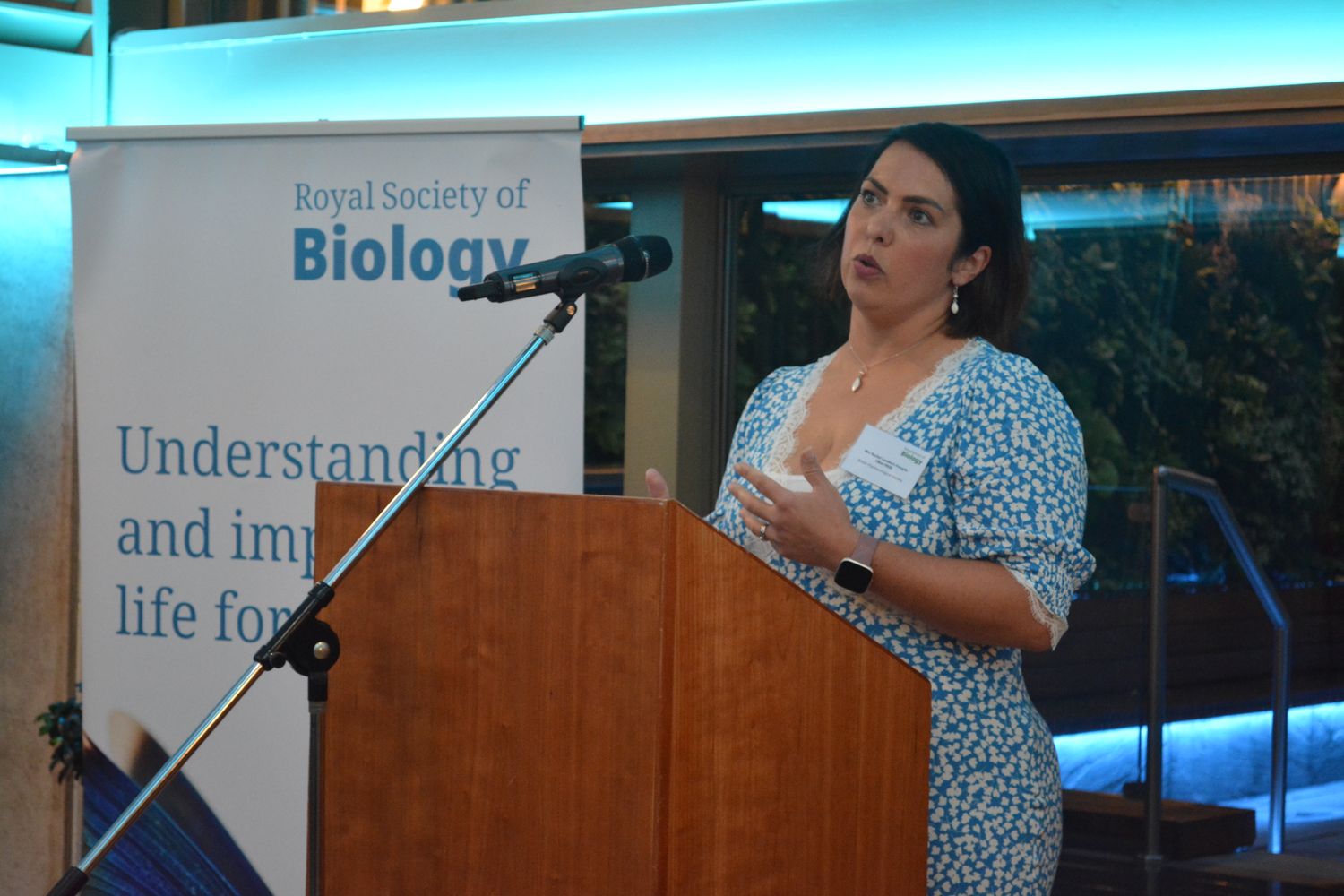 Rachel Lambert-Forsyth giving speech at lectern in front of RSB banner