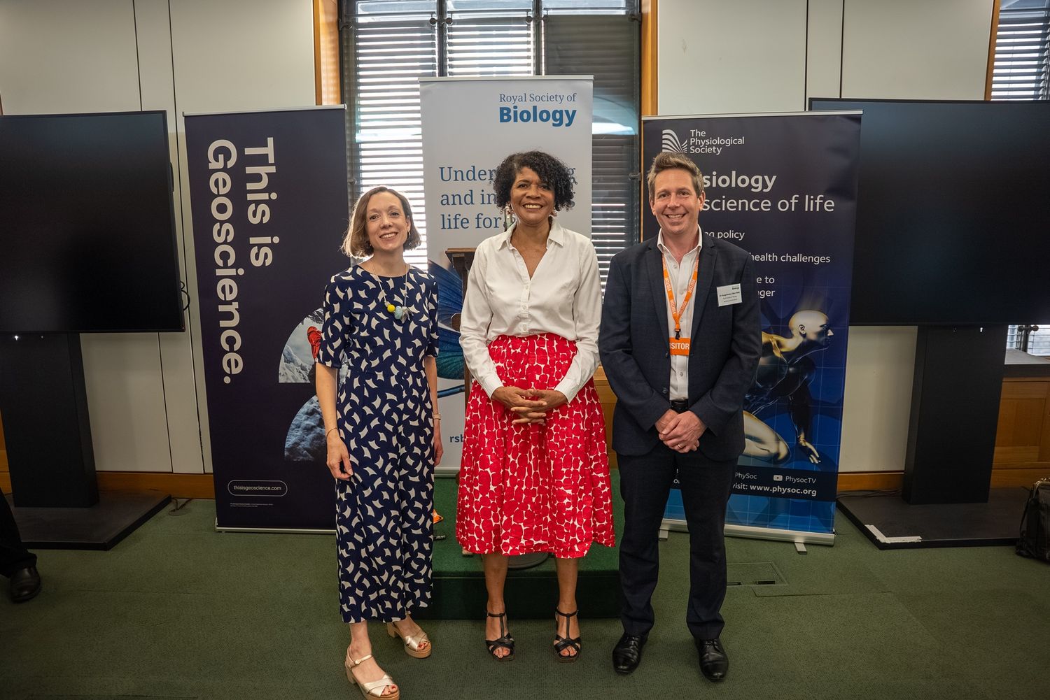Hannah Russell, Dame Chi Onwurah, and Dr Doug Brown stand together in front of RSB banner