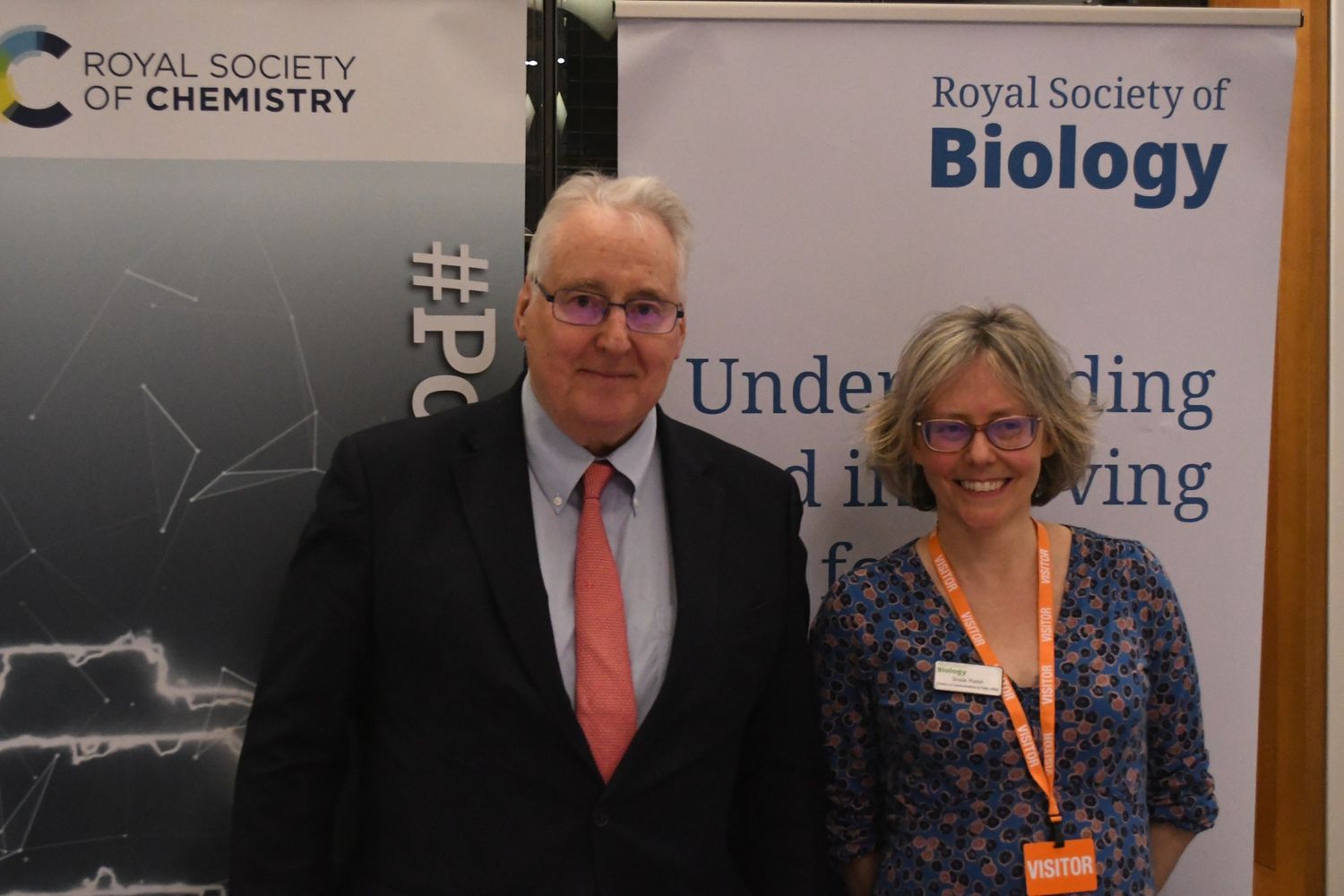 The Viscount Stansgate with Susie Rabin in front of RSB banner